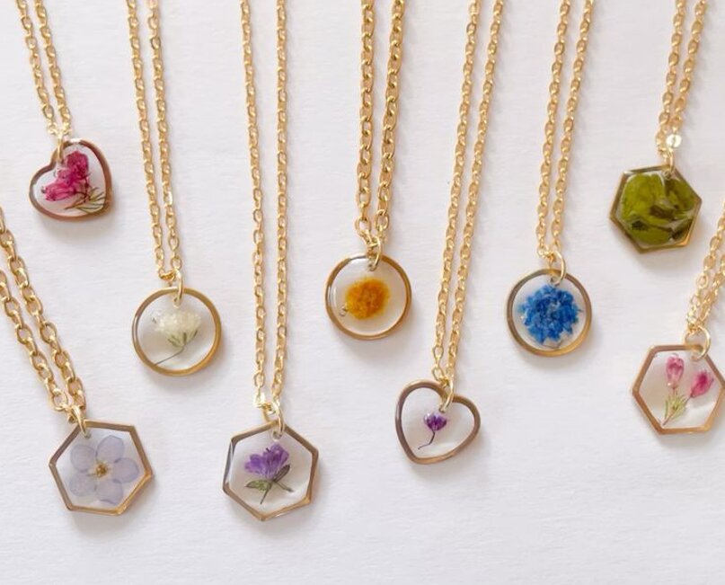 A custom gold pendant with jasmine petals from a Nikkah