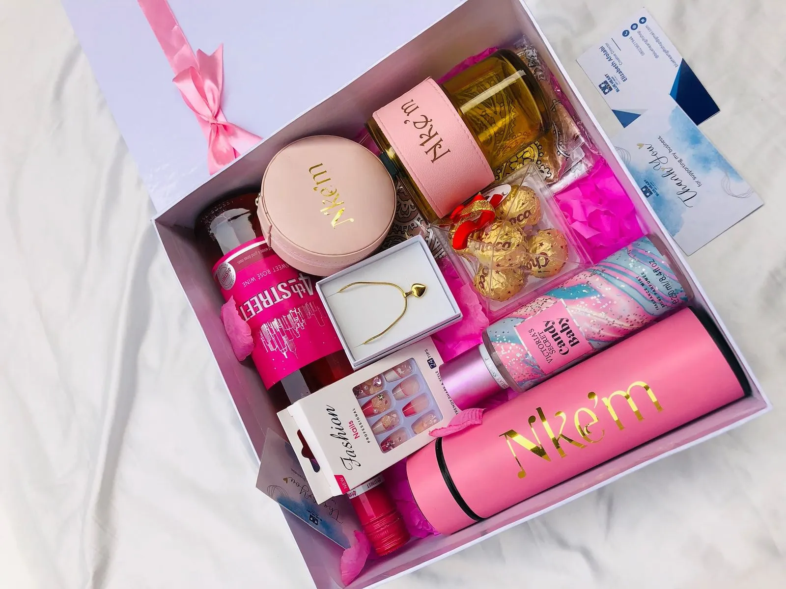 Handmade gift for sister by Khaas Items jewelry, gift box, and handwritten card arranged flat lay